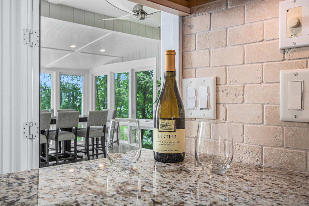 Wine bottle and glasses on kitchen counter
