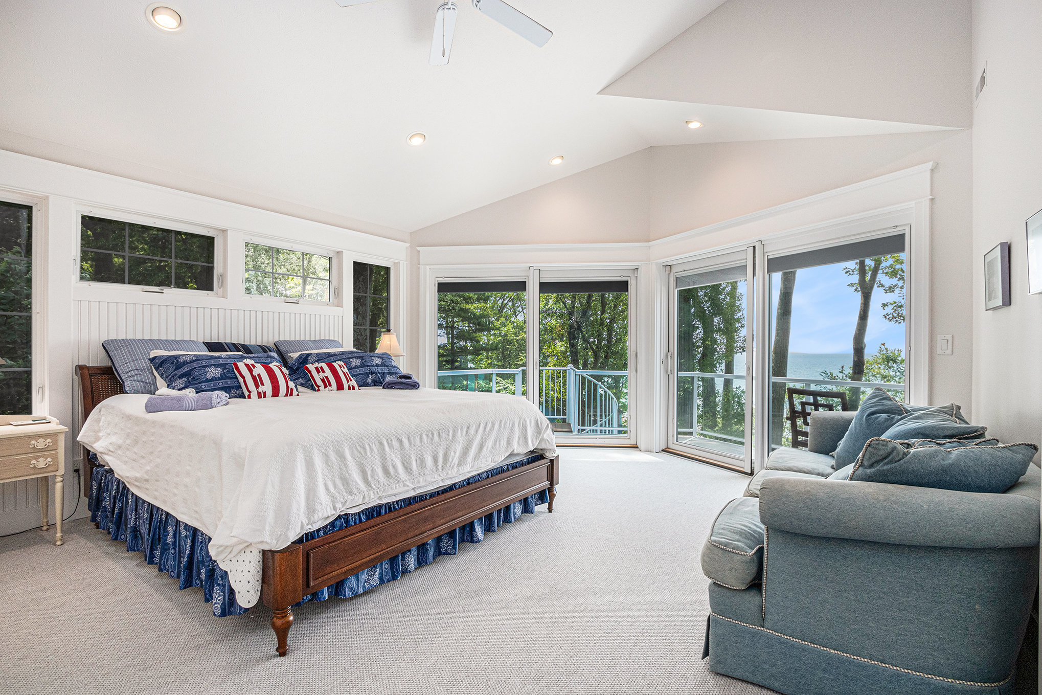 Spacious bedroom with lake view and large windows