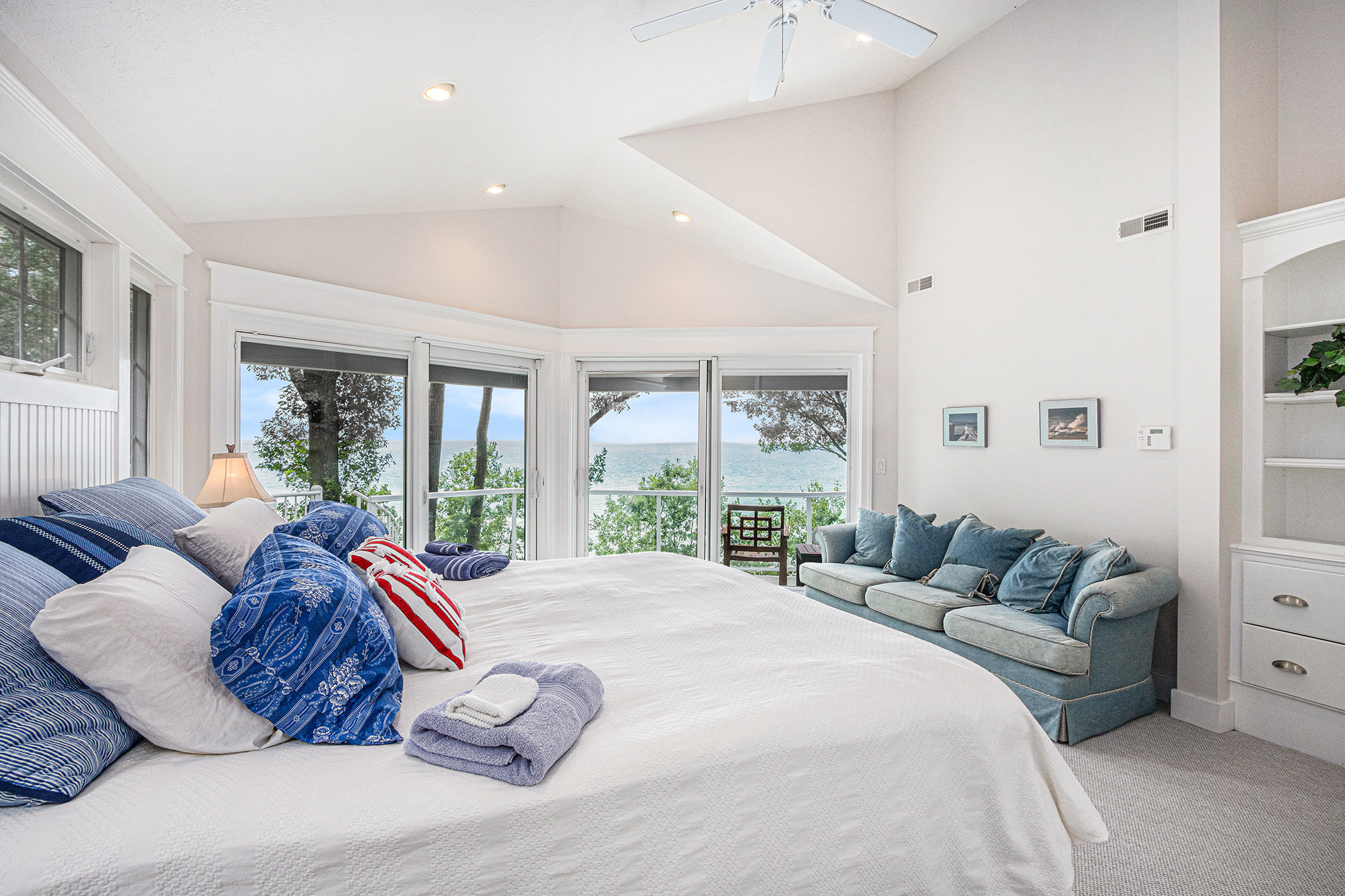 Coastal bedroom with ocean view and large windows