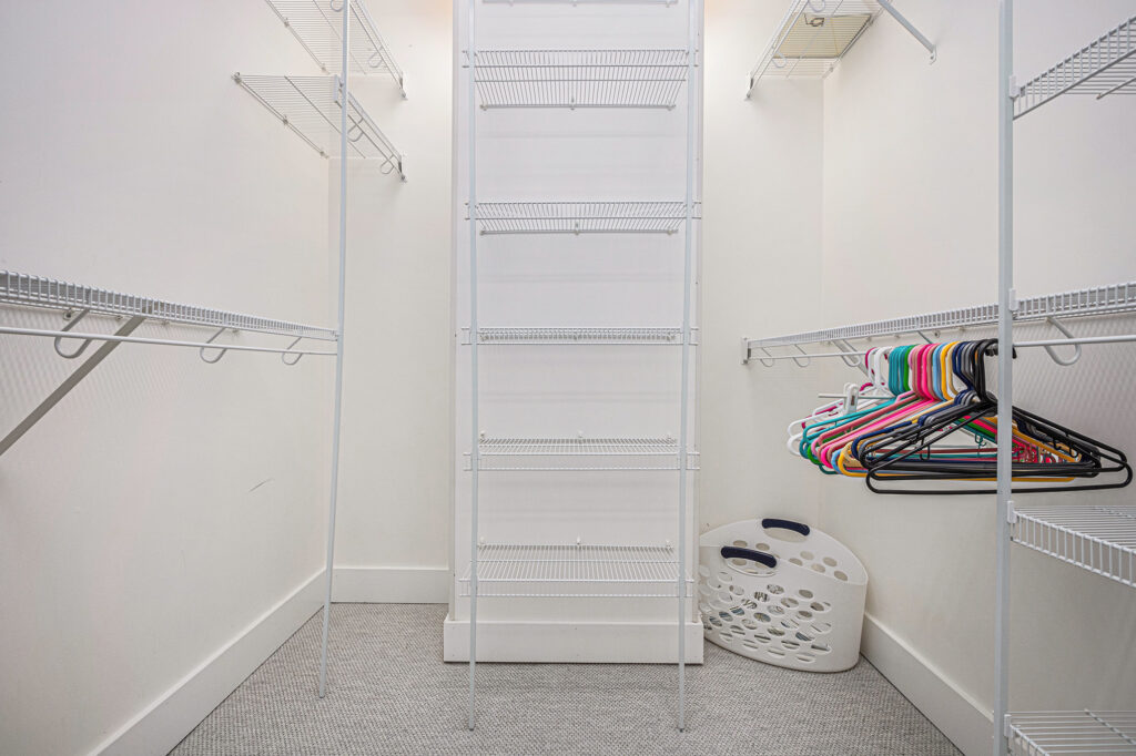 Empty walk-in closet with wire shelving