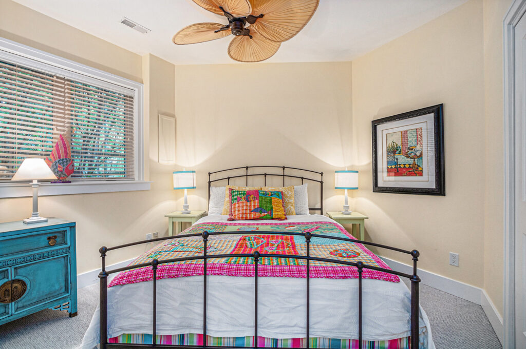 Colorful bedroom with metal bed and bright decor