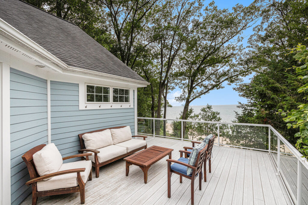 Beachfront patio with outdoor seating and ocean view