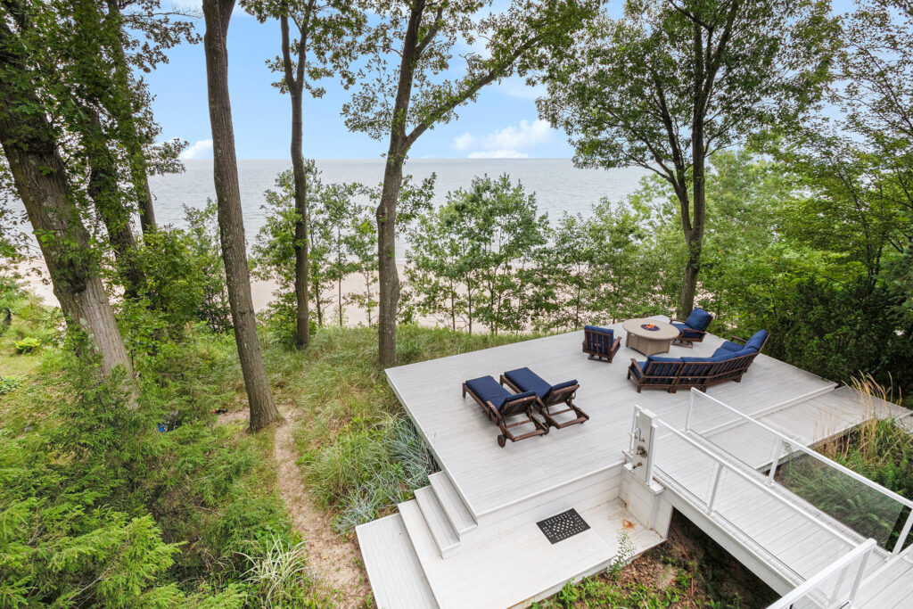 Beachfront deck with chairs and ocean view