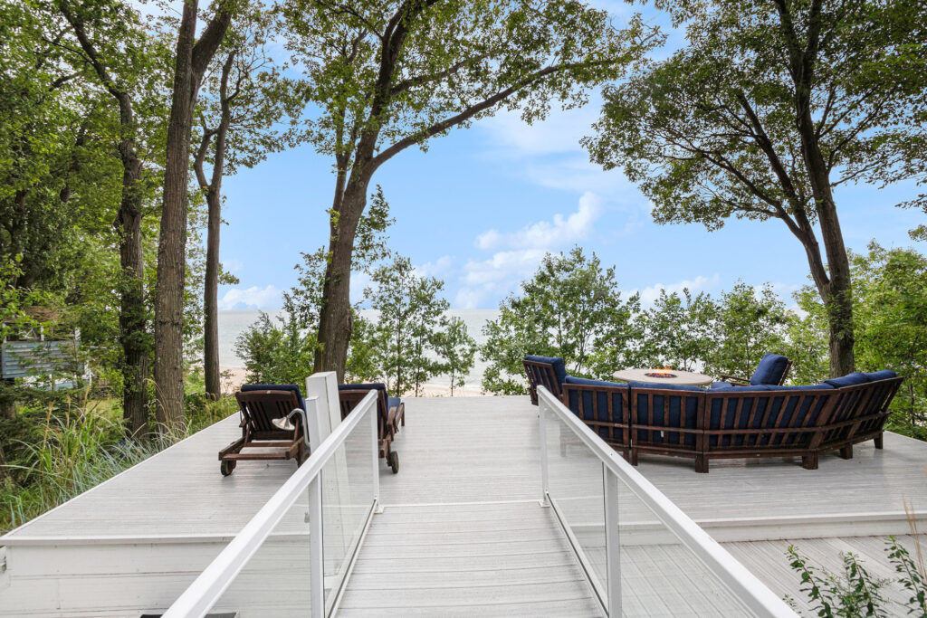 Deck with seating overlooking beach and ocean