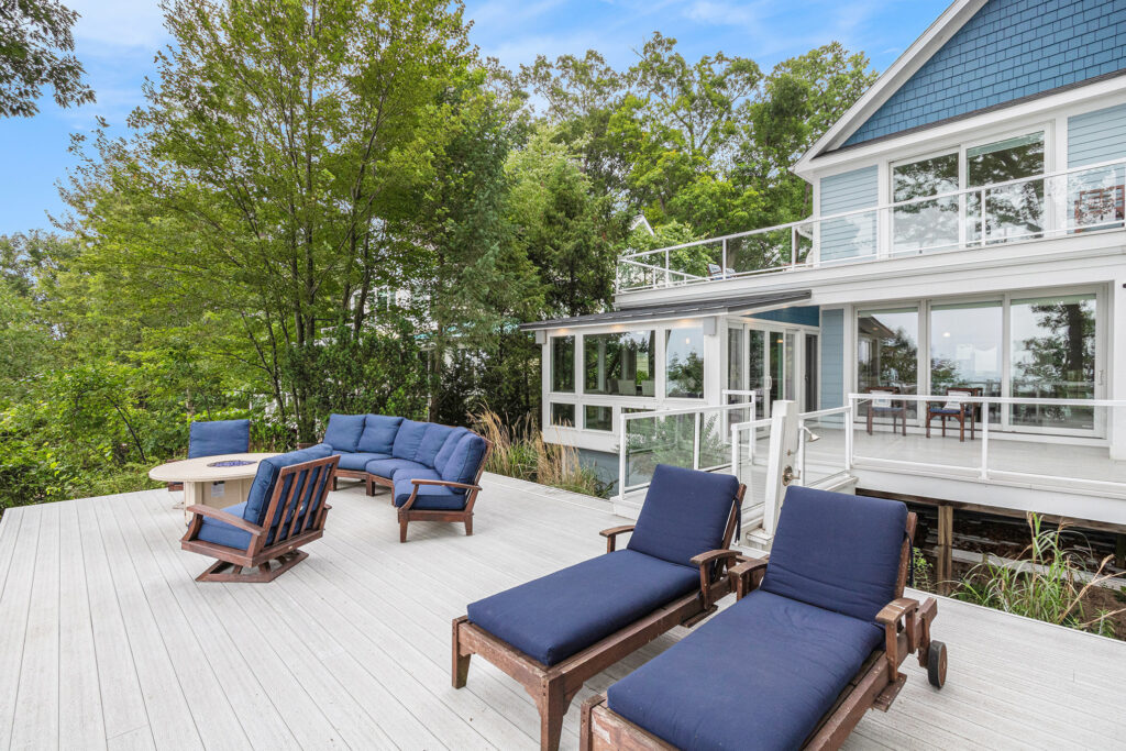 Modern lakeside house with outdoor deck seating