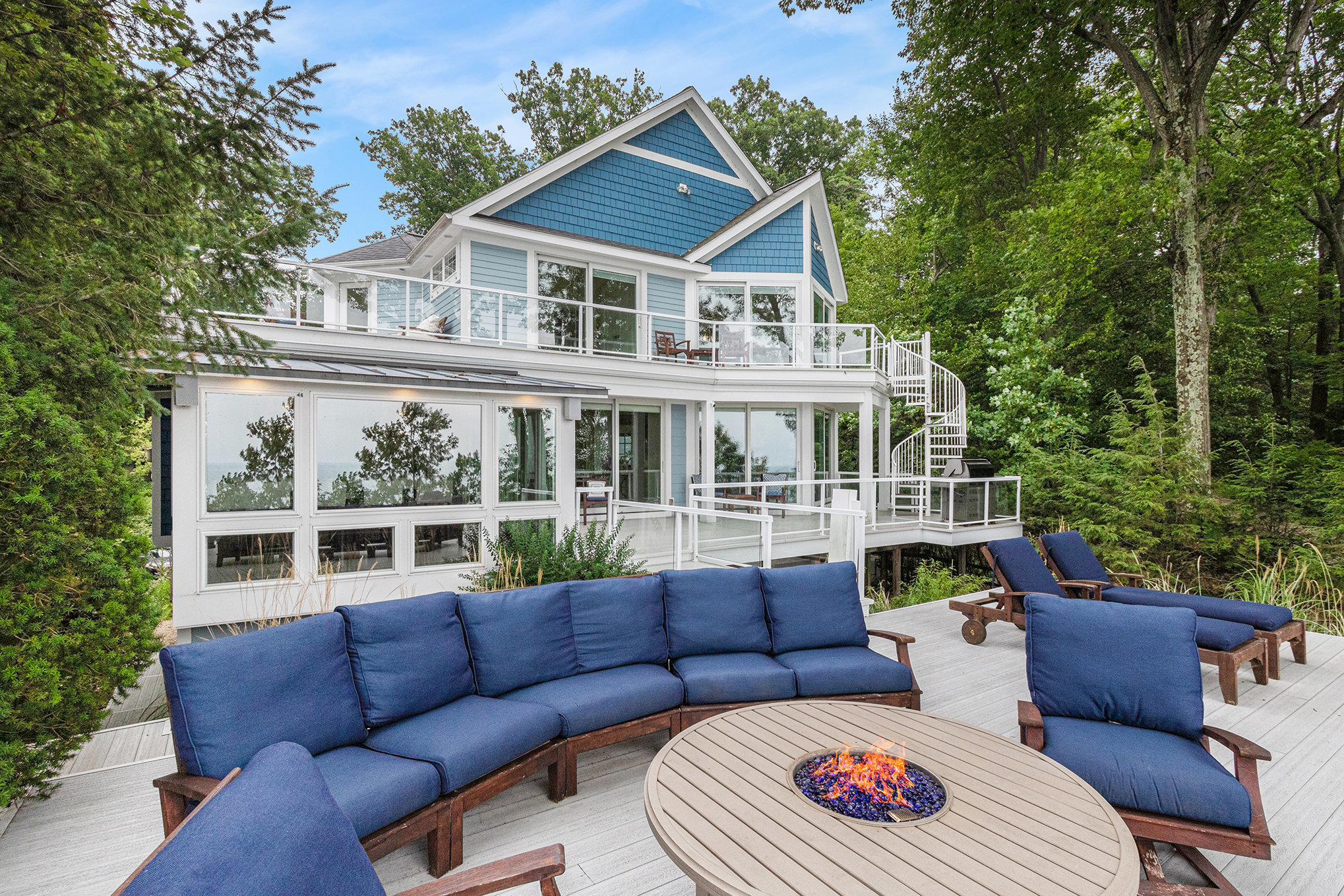 Modern lake house with patio fire pit