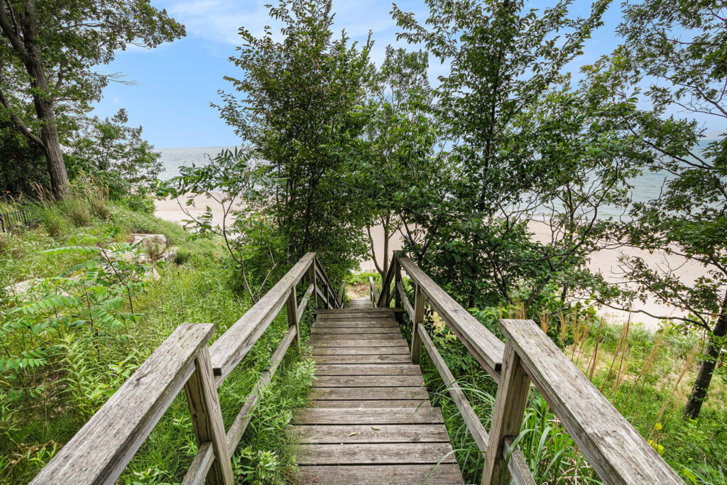 Wooden stairs leading to sandy beach