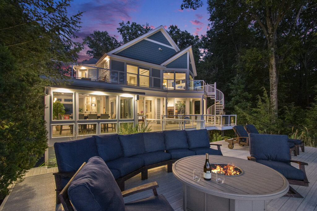 Modern house with outdoor fire pit at sunset