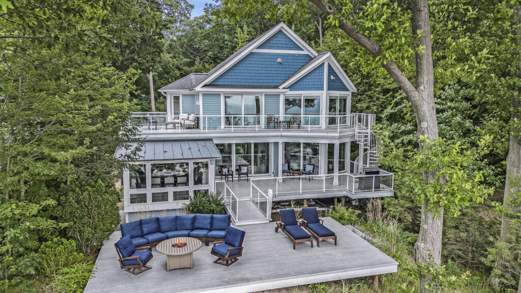 Modern blue lake house with large deck