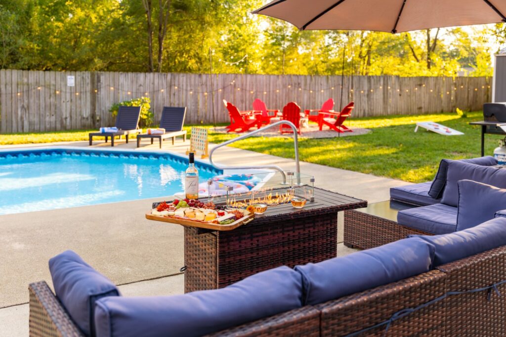 Backyard pool with lounge chairs and snacks