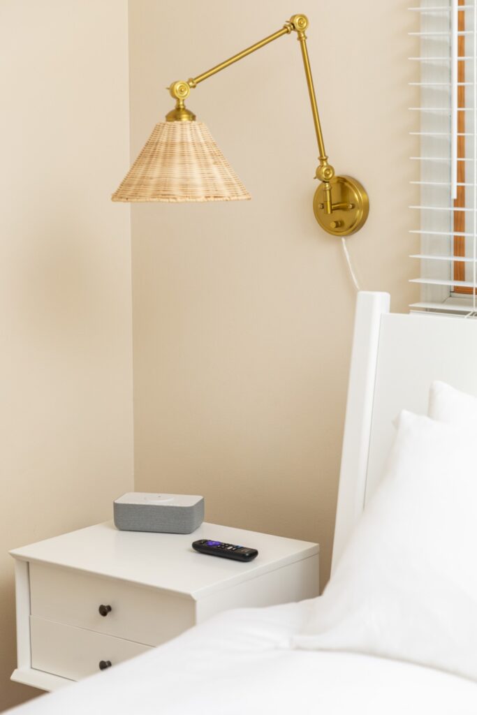 Bedroom nightstand with lamp and remote control