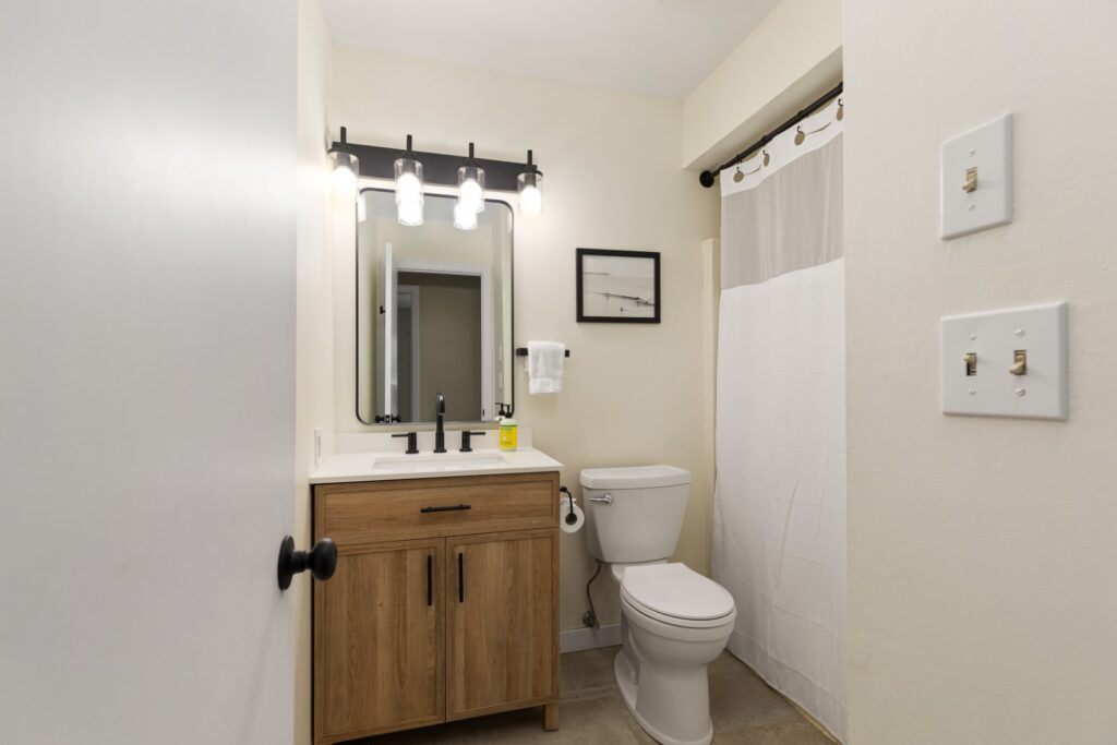 Modern bathroom with wood vanity and shower