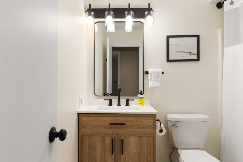 Modern bathroom with wooden vanity and mirror