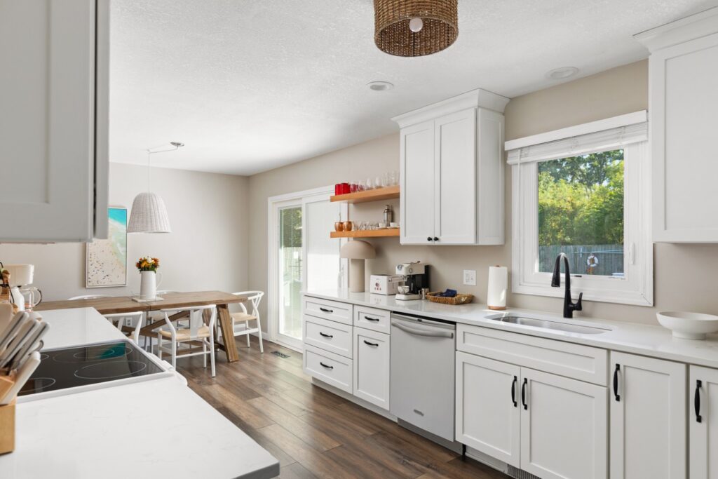 Modern white kitchen with dining area