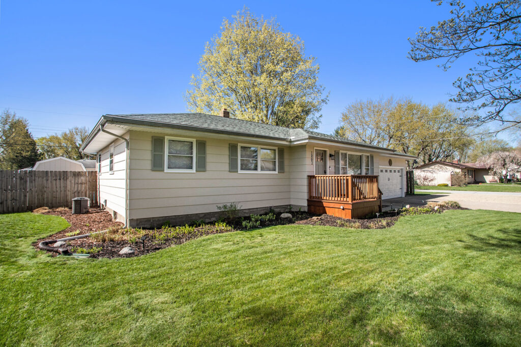 Single-story suburban house with front lawn