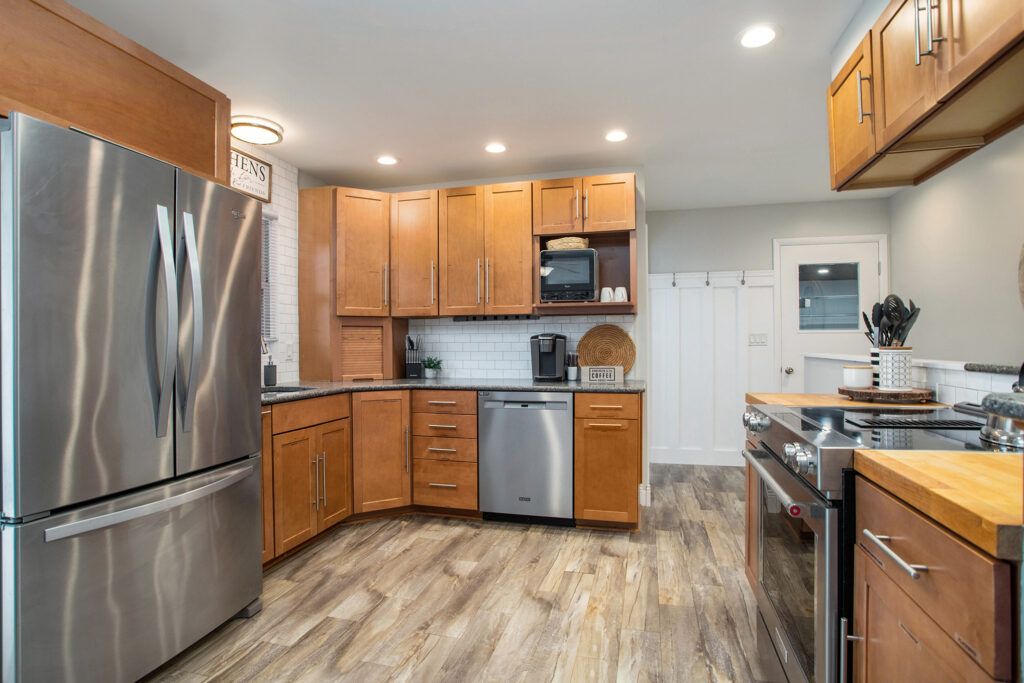 Modern kitchen with wooden cabinets and stainless appliances