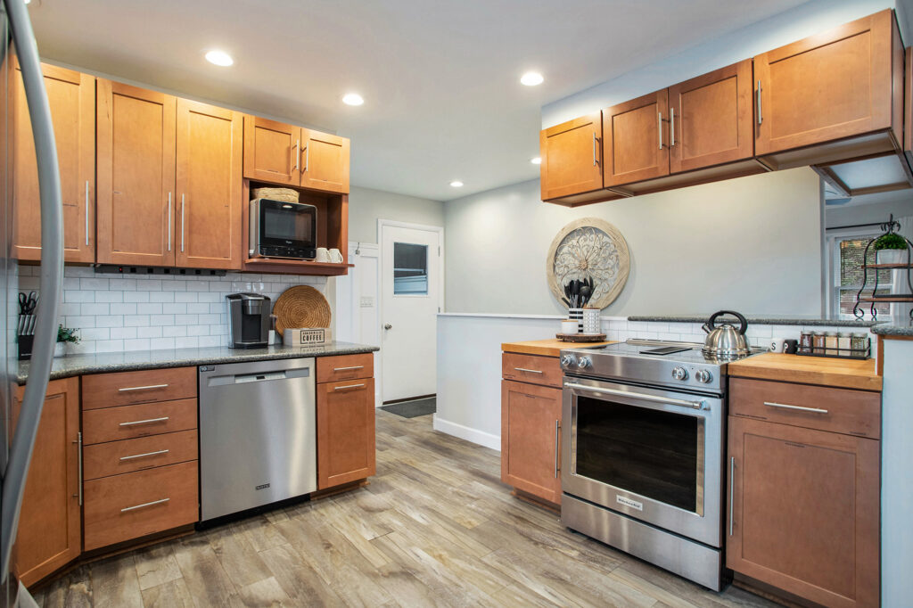 Modern kitchen with wooden cabinets and stainless appliances