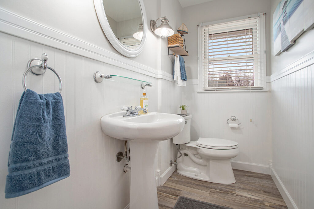 Bright bathroom with white sink and toilet