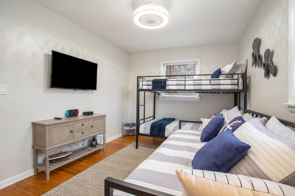 Modern bedroom with bunk beds and TV