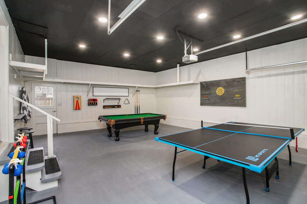 Game room with pool and ping pong tables