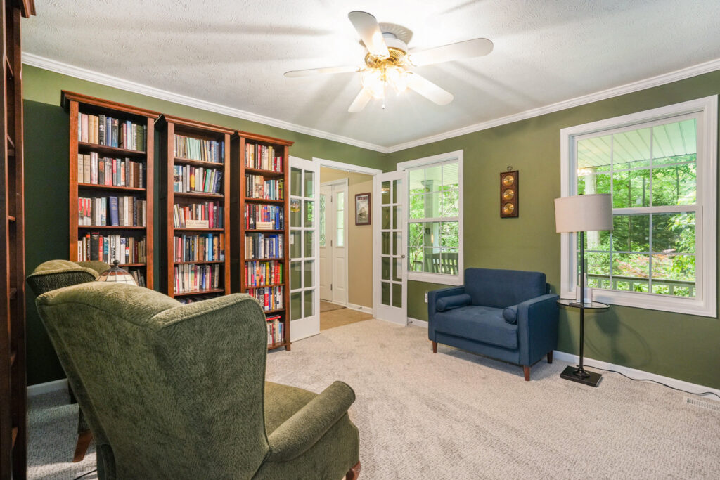 Cozy home library with bookshelves and armchairs