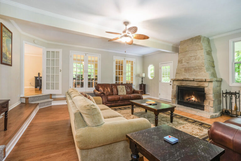 Cozy living room with fireplace and leather seating