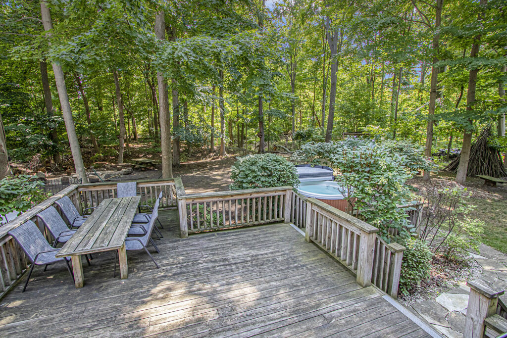 Wooden deck with table and forest view