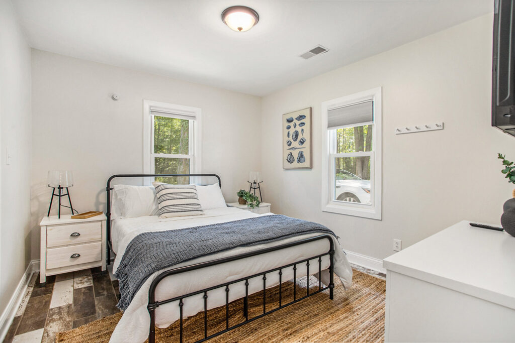 Bright bedroom with modern decor and metal bed frame