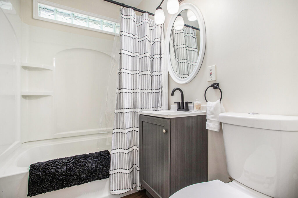 Modern bathroom with vanity and shower curtain