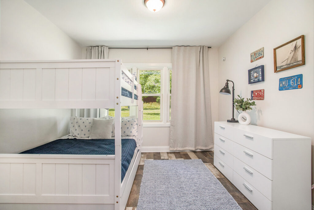 Bright bedroom with bunk bed and dresser