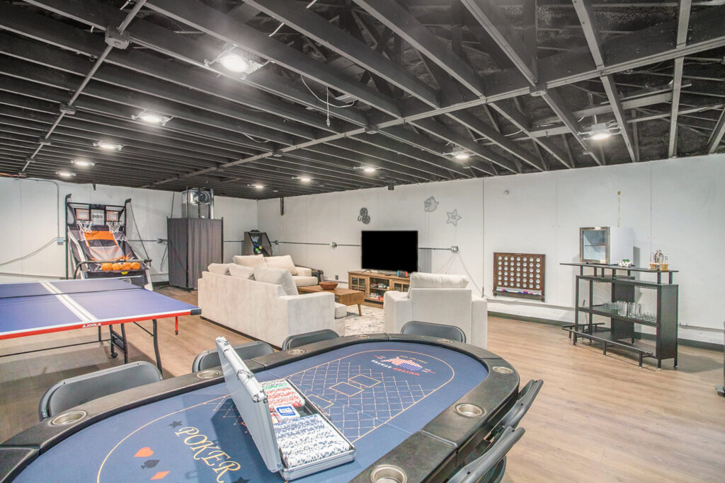 Modern basement game room with entertainment area