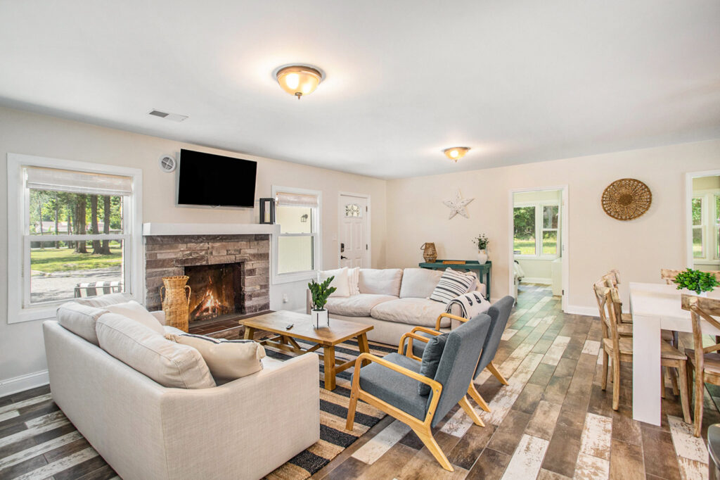 Bright living room with fireplace and wooden floor