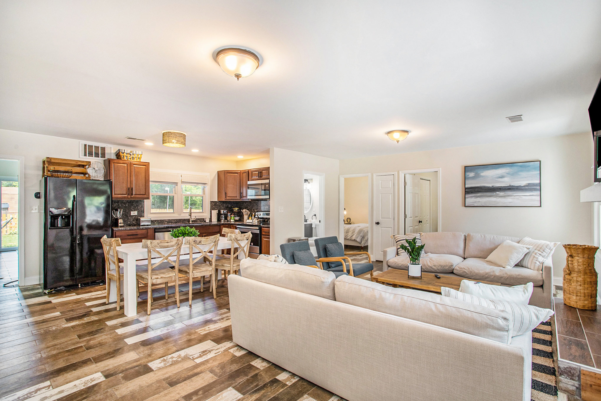 Modern open kitchen and cozy living room interior