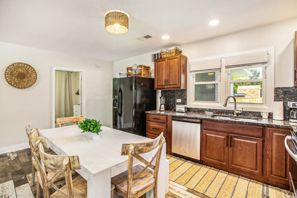 Modern kitchen with wooden cabinets and dining table