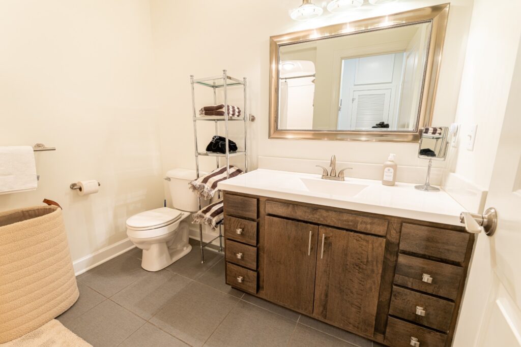 Modern bathroom with wooden vanity and mirror