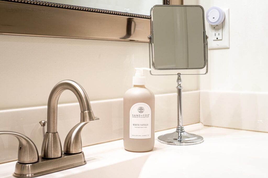 Bathroom sink with soap and mirror