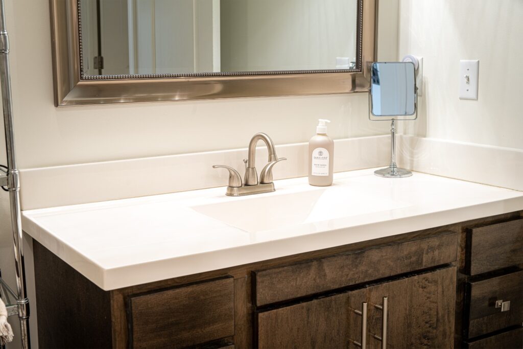 Modern bathroom sink with mirror and soap dispenser
