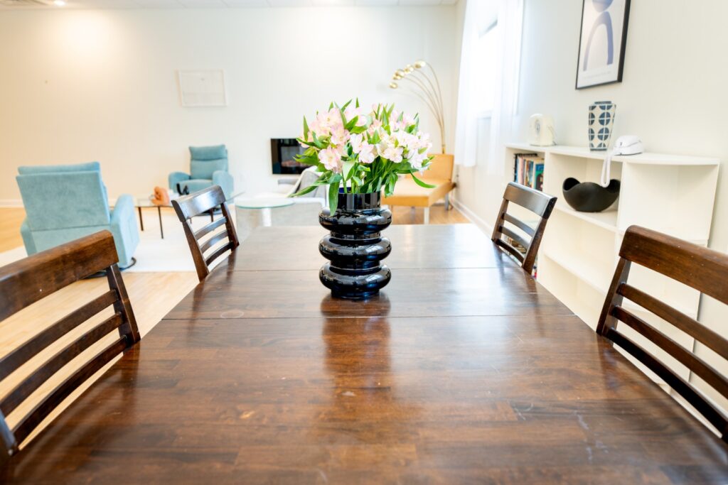 Modern dining room with flowers on table