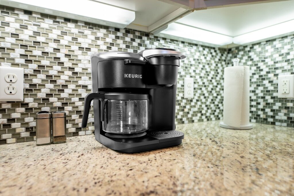 Black coffee maker on granite kitchen counter