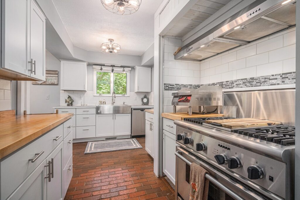 Modern kitchen with stainless steel appliances and white cabinets
