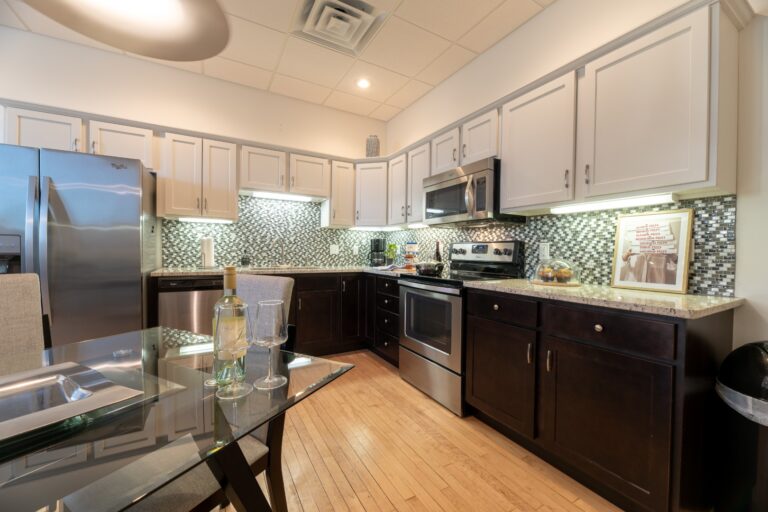 Modern kitchen with stainless steel appliances and cabinets