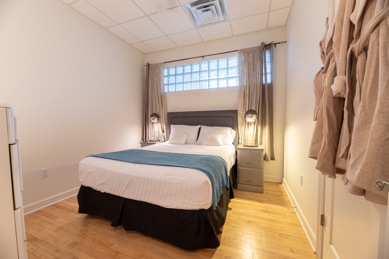 Cozy bedroom with bed and warm lighting