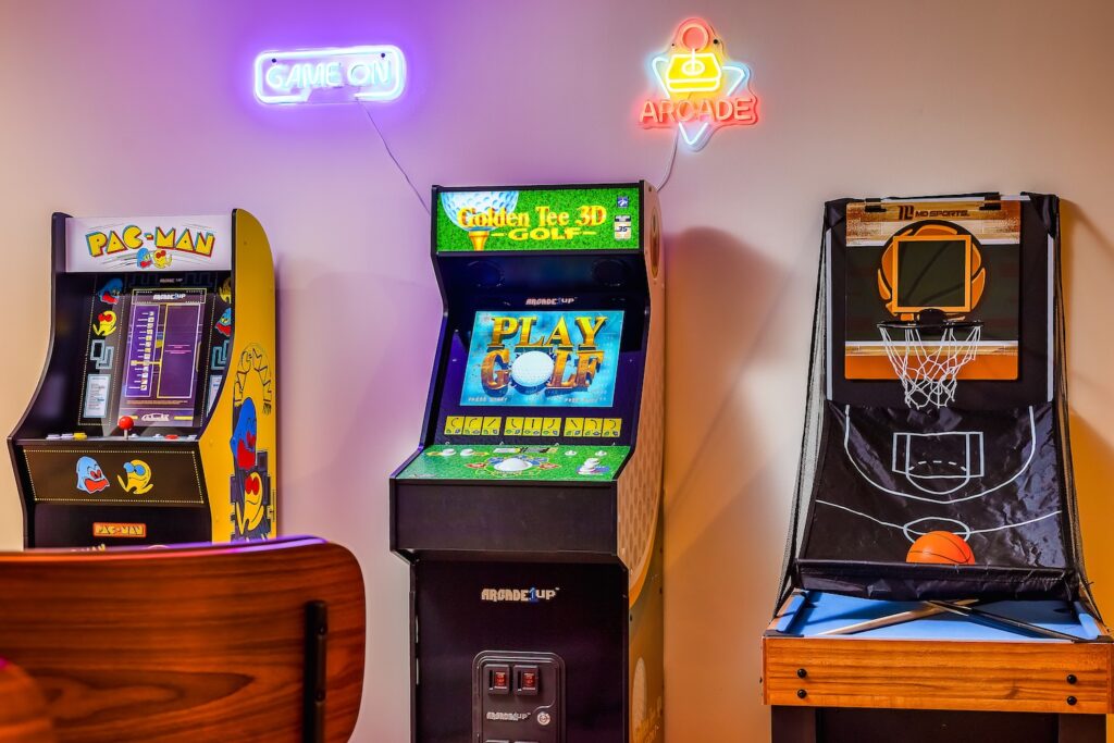 Arcade machines and basketball game in game room