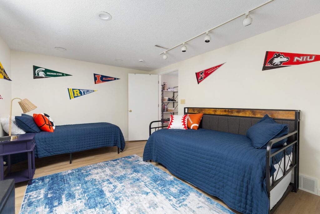 Bedroom with twin beds and sports theme decor
