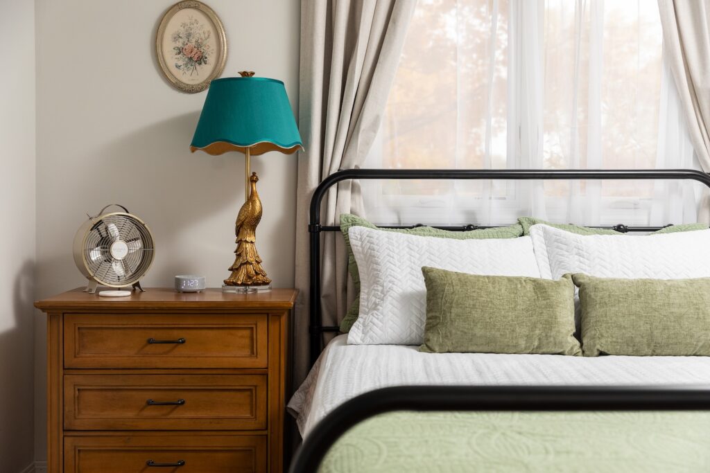 Cozy bedroom with green and white bedding