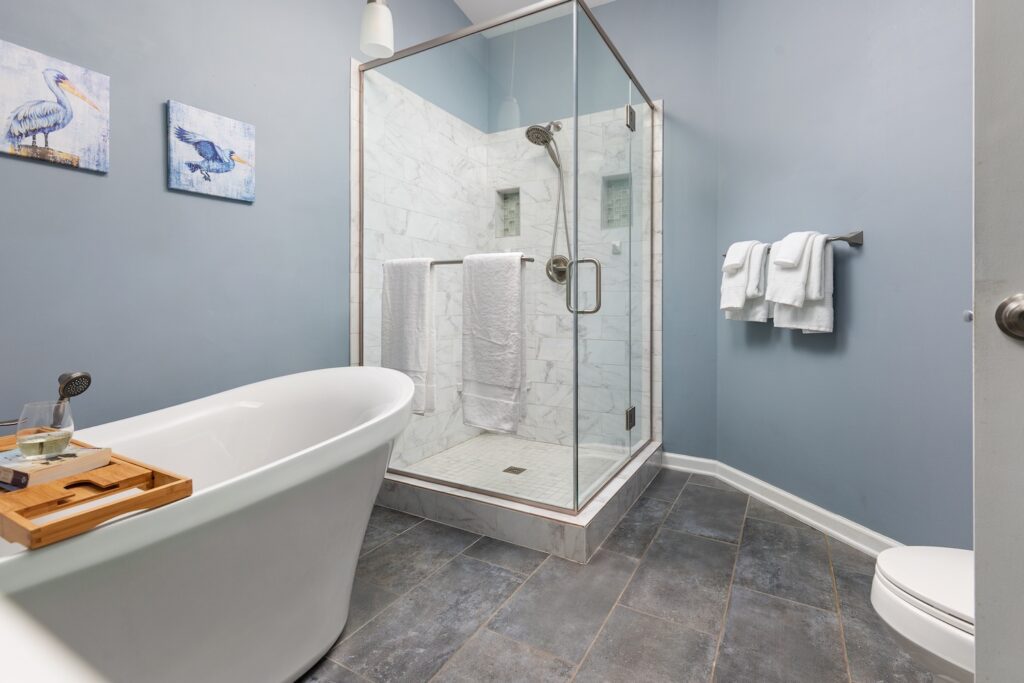Modern bathroom with glass shower and bathtub