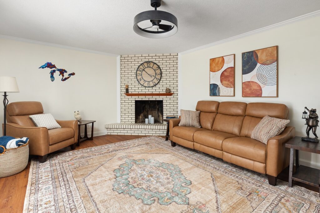 Cozy living room with fireplace and leather furniture